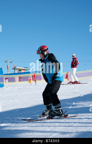 a young boy getting skiing lessons at mountain station Gamsgarten at Stubai Glacier in Tyrol, Austria Stock Photo