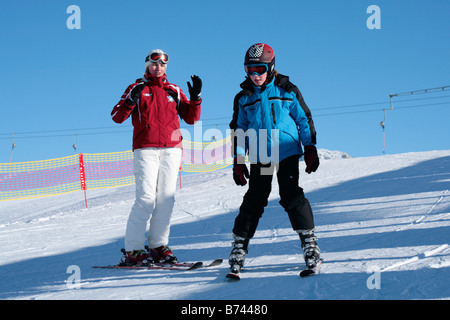 a young boy getting skiing lessons at mountain station Gamsgarten at Stubai Glacier in Tyrol, Austria Stock Photo