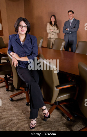 Business people standing in conference room Stock Photo