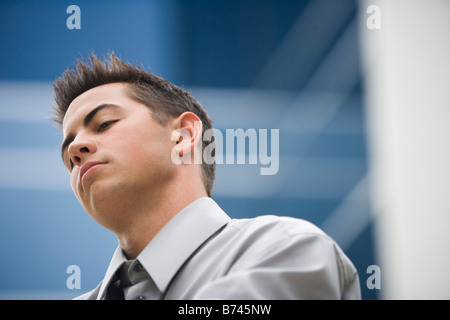 Close-up of young man wearing shirt and tie Stock Photo