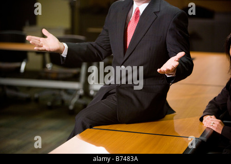 Mid section of businessman in boardroom Stock Photo
