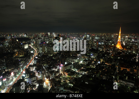 Night city view of Tokyo looking towards the districts of Toranomon Kamiyacho Uchisaiwaicho and Tokyo Tower Stock Photo