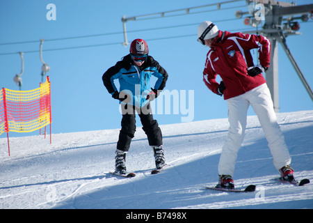 a young boy getting skiing lessons at mountain station Gamsgarten at Stubai Glacier in Tyrol, Austria Stock Photo