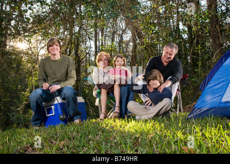 Portrait of family together on camping trip at campsite Stock Photo