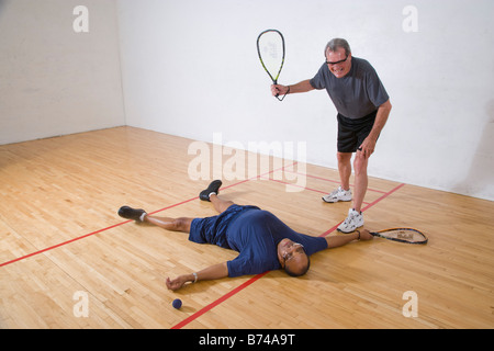 Senior men playing racketball, having fun Stock Photo