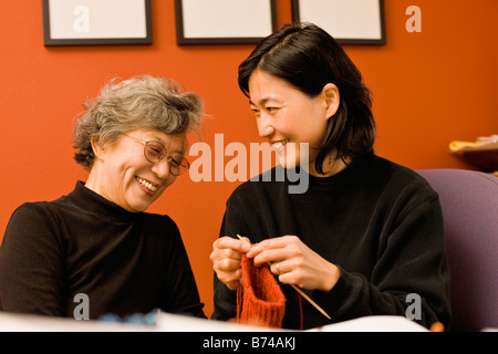 Asian mother and daughter knitting Stock Photo