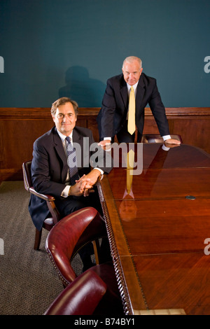 Businesspeople by table in office Stock Photo