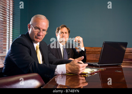Two corporate executives working together at conference room table Stock Photo