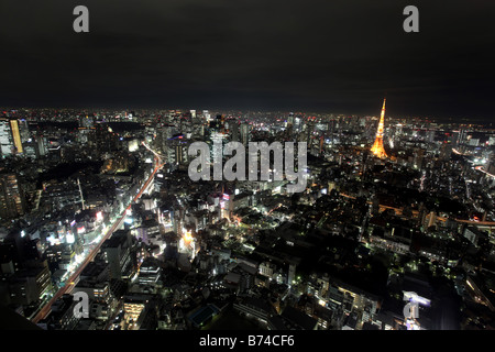 Night city view of Tokyo looking towards the districts of Toranomon Kamiyacho Uchisaiwaicho and Tokyo Tower Stock Photo