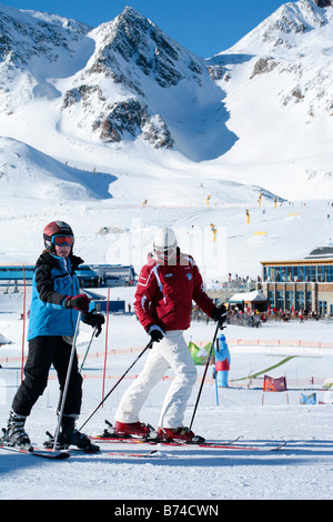 a young boy getting skiing lessons at mountain station Gamsgarten at Stubai Glacier in Tyrol, Austria Stock Photo