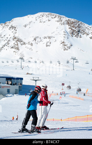 a young boy getting skiing lessons at mountain station Gamsgarten at Stubai Glacier in Tyrol, Austria Stock Photo