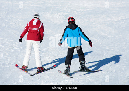 a young boy getting skiing lessons at mountain station Gamsgarten at Stubai Glacier in Tyrol, Austria Stock Photo