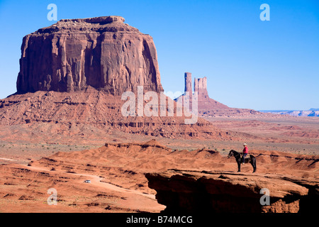 Man on horse on edge of cliff at John Ford Point in Monument Valley Navajo Tribal Park, Arizona, USA Stock Photo