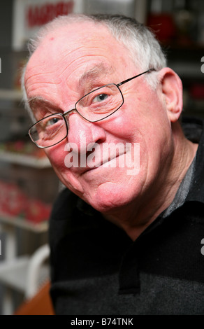 Pensioner smiling wearing glasses Stock Photo