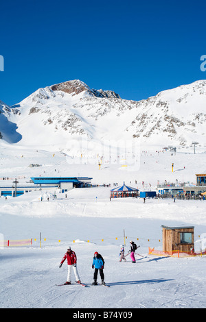 a young boy getting skiing lessons at mountain station Gamsgarten at Stubai Glacier in Tyrol, Austria Stock Photo