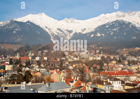 panoramic view of Innsbruck with snow covered mountains in the background taken from City Tower Stock Photo