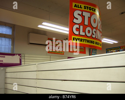 STORE CLOSING / Fixtures & Fittings for sale - signs in a store closing sale due to Liquidation. (Woolworths) Stock Photo
