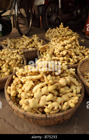 Baskets of ginger for sale at a Vietnamese market in My Tho, Mekong Delta, Vietnam Stock Photo