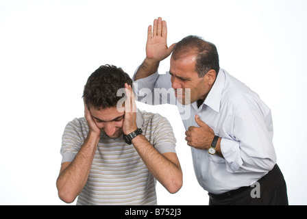 Father hitting son Stock Photo