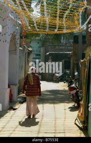 view of nawalgarh street with local man in traditional dress and overhead wedding decorations Stock Photo