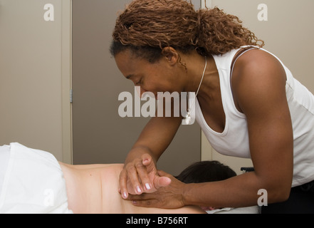 Person receiving massage therapy, British Columbia, Canada Stock Photo