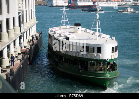 Star Ferry berthing at terminal, Central Pier, Sheung Wan, Victoria Harbour, Hong Kong Island, Hong Kong, China Stock Photo