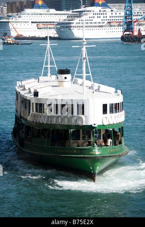 Star Ferry berthing at terminal, Central Pier, Sheung Wan, Victoria Harbour, Hong Kong Island, Hong Kong, China Stock Photo