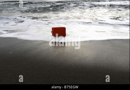 Plastic Container Bottle Washed up on Beach Stock Photo