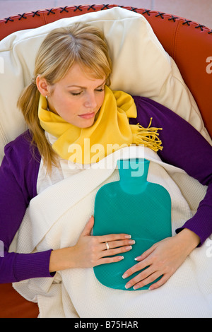 Frau mit einer Erkaeltung, woman having a cold Stock Photo