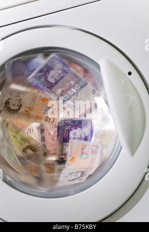 Energy costs, Money Laundering, Banknotes in washing machine. Stock Photo