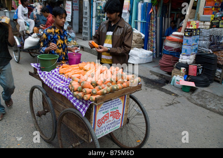 Street vendor selling carrots in Dhaka Bangladesh Stock Photo