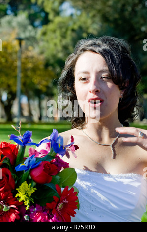 Bride after her wedding holding onto her bouquet of flowers Stock Photo