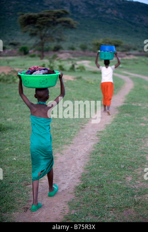 Ngoiroro is a village of 200 inhabitants all belonging to the Massai Tribe The village lays right in the rift valley south of Nairobi against the tanzanian border Girls and women are responsible for doing the laundry at the riversite Stock Photo