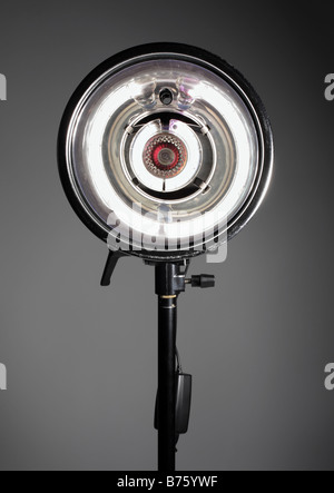 photo of studio light on stand firing at camera Stock Photo