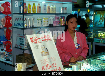 Chinese people, salesclerk, cosmetic counter, department store, city of Kunming, Yunnan Province, China Stock Photo