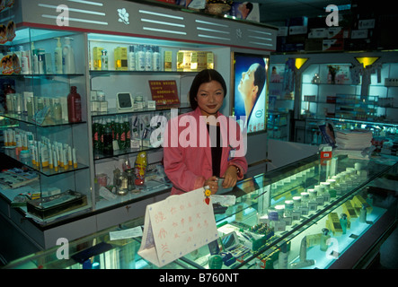 Chinese people, salesclerk, cosmetic counter, department store, city of Kunming, Yunnan Province, China Stock Photo