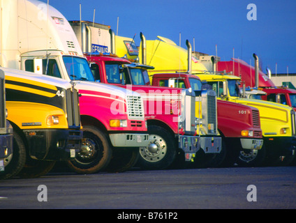 a row of tractor trailer trucks Stock Photo