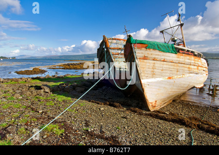 Abandoned and ruined fishing trawlers near Salen on the shoreline of the Sound of Mull, taken on a birght sunny autumn day Stock Photo