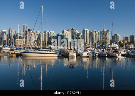 A view from Vancouver's Stanley Park looking across the boats moored in Coal Harbour towards the city s downtown Stock Photo