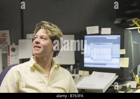 Male customer service representative smiling in an office Stock Photo