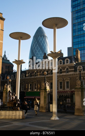 Gherkin or Swiss Re Tower as seen from the outside of the Liverpool Street station, London, UK Stock Photo