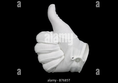 Hand in a white cotton glove gesturing a thumbs up sign isolated on a black background Invisible man effect on glove Stock Photo