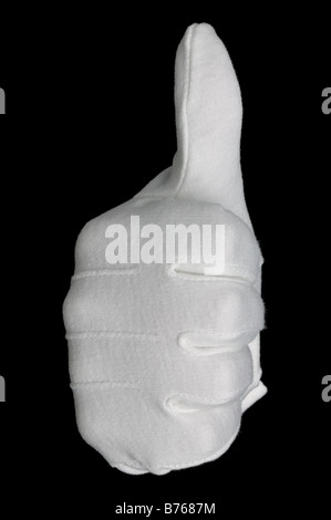 Front view of a hand in a white cotton glove gesturing a thumbs up sign isolated on a black background Stock Photo