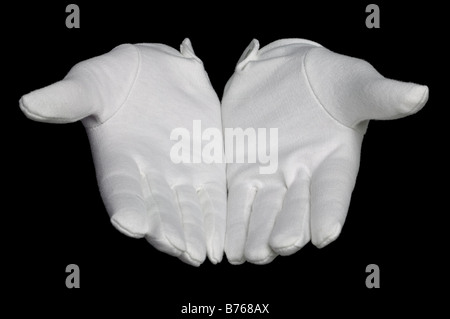 Open hands palms up in white gloves isolated on a black background Stock Photo