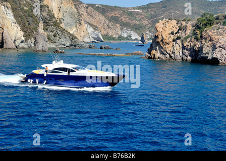 A luxury leisure cruising boat leaving from the Ponza harbour, Ponza island, Lazio, Italy, Europe. Stock Photo