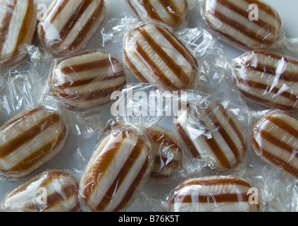 Humbug mint sweets in shiny wrappers Stock Photo