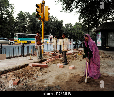 street pavement construction workers Bhagwan Dass Rd New Delhi Stock Photo