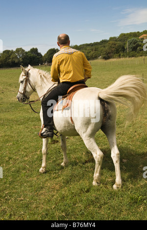 Gardian on Camargue pony Stock Photo