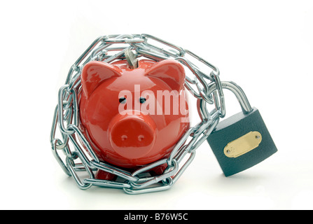 A RED PIGGYBANK PROTECTED BY PADLOCK AND CHAIN. Stock Photo