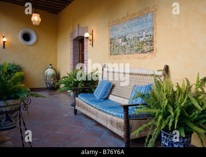 RATTAN COUCH in the hotel POSADA DE LAS MINAS in the ghost town of MINERAL DE POZOS GUANAJUATO MEXICO Stock Photo